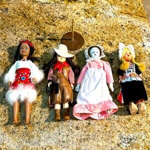 Vtg lot of assorted dolls &‎ 1 wooden stand